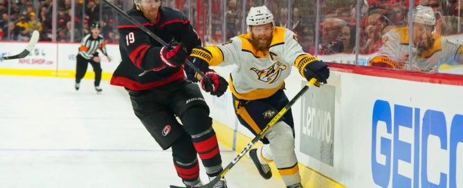 Defensemen Dougie Hamilton (19) and Ryan Ellis (4) chase the puck at PNC Arena. (Photo: James Guillory-USA TODAY Sports)